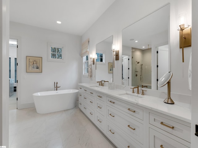 full bath featuring double vanity, a stall shower, marble finish floor, and a sink