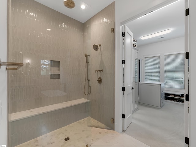 bathroom with visible vents and a walk in shower