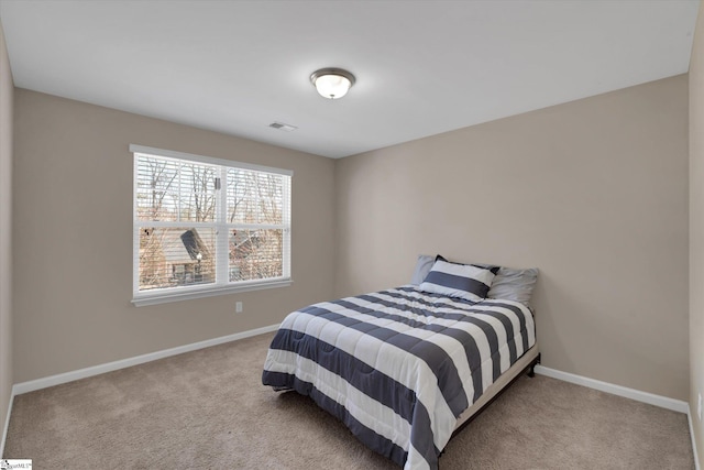 bedroom featuring carpet, visible vents, and baseboards