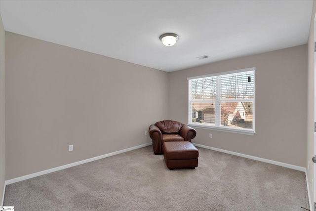 unfurnished room with baseboards, visible vents, and carpet flooring