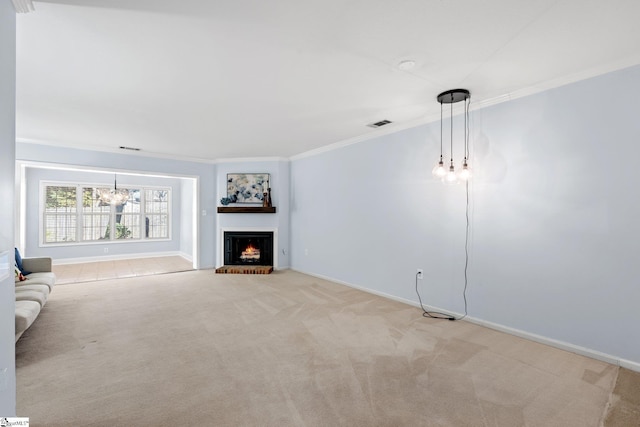 unfurnished living room with a brick fireplace, baseboards, ornamental molding, and light colored carpet