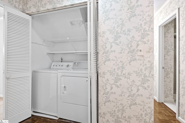 laundry room featuring laundry area, washing machine and clothes dryer, and wallpapered walls