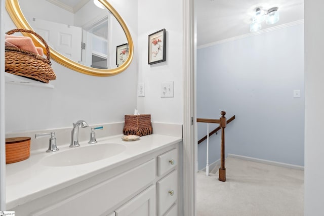 bathroom featuring ornamental molding, vanity, and baseboards