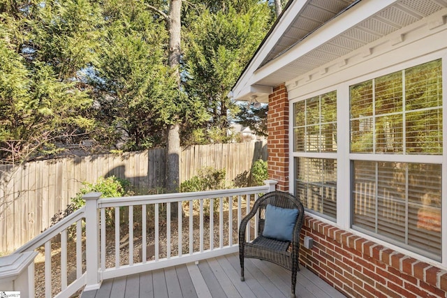 wooden terrace featuring fence