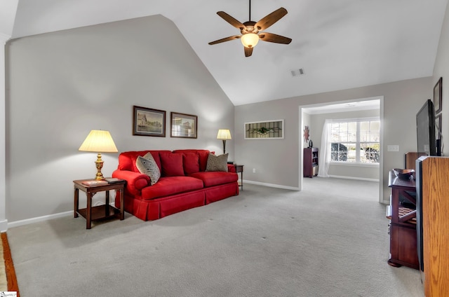 carpeted living area with a ceiling fan, baseboards, visible vents, and high vaulted ceiling