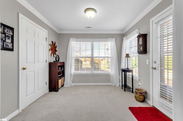 living area featuring visible vents, carpet floors, baseboards, and crown molding