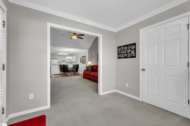 hallway with baseboards, carpet floors, an inviting chandelier, and ornamental molding