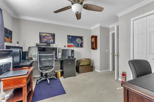 home office with carpet flooring, baseboards, ceiling fan, and crown molding