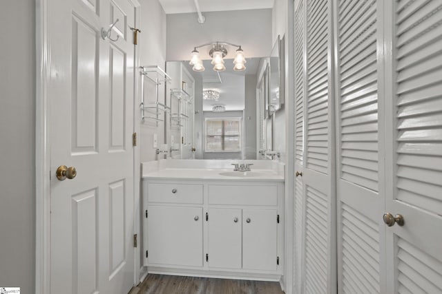 bathroom featuring vanity and wood finished floors