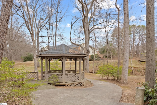 view of property's community with a gazebo and aphalt driveway