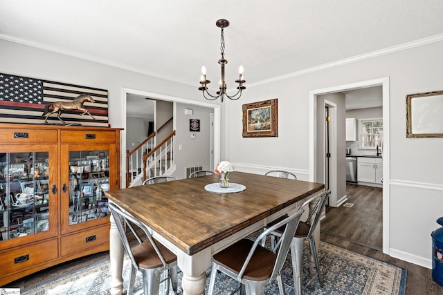 dining room featuring a chandelier, stairway, ornamental molding, and dark wood-style flooring