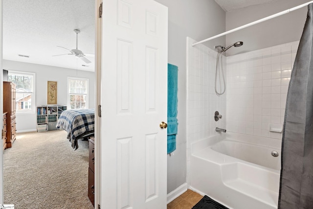 bathroom with visible vents, connected bathroom, baseboards, shower / bathtub combination, and a textured ceiling