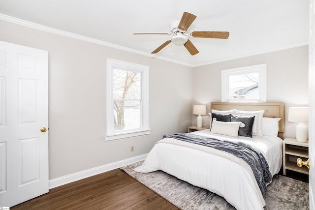 bedroom with ceiling fan, baseboards, wood finished floors, and ornamental molding