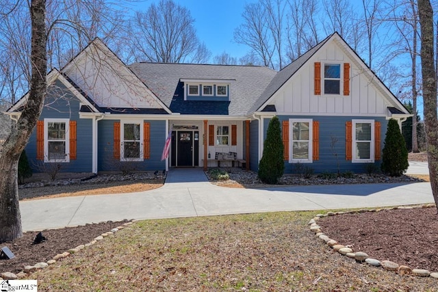 view of front of home featuring a porch, board and batten siding, and a shingled roof