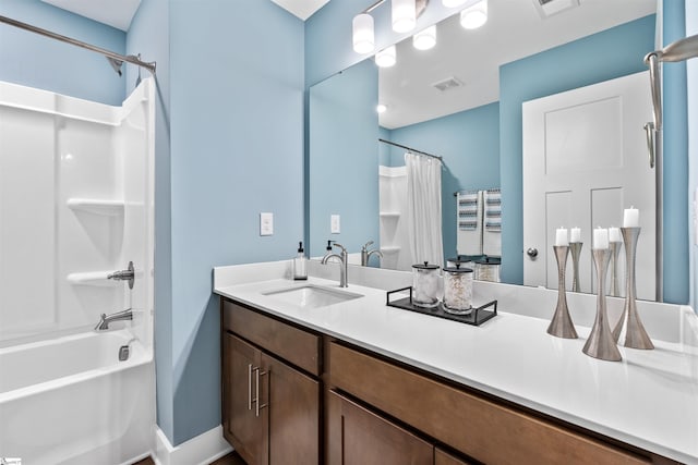 full bathroom featuring visible vents, baseboards, vanity, and shower / tub combo