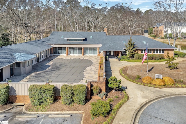 view of front of home featuring a shingled roof