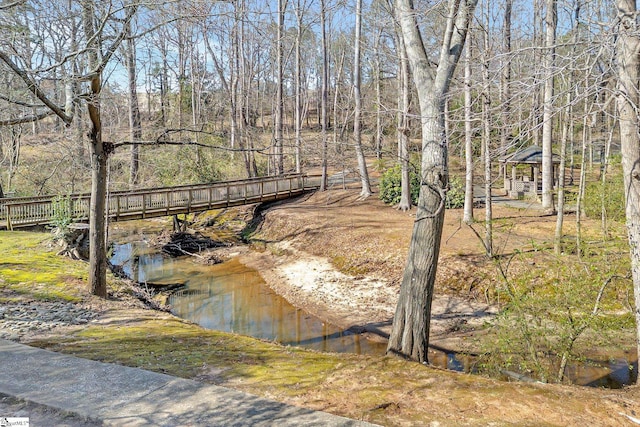 exterior space featuring a view of trees