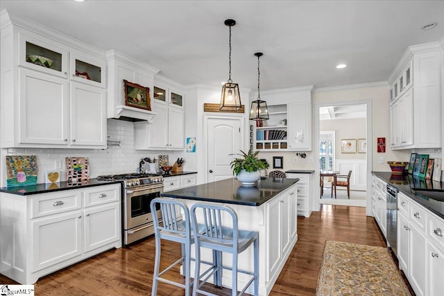 kitchen featuring dark countertops, open shelves, and appliances with stainless steel finishes