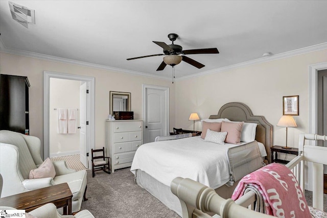 carpeted bedroom featuring ceiling fan, connected bathroom, visible vents, and ornamental molding
