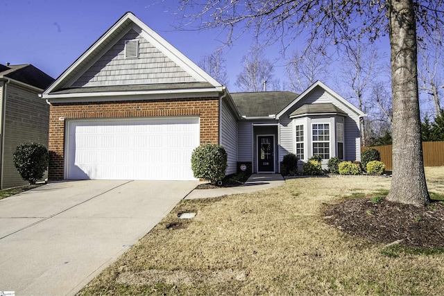 single story home with driveway, brick siding, an attached garage, and fence