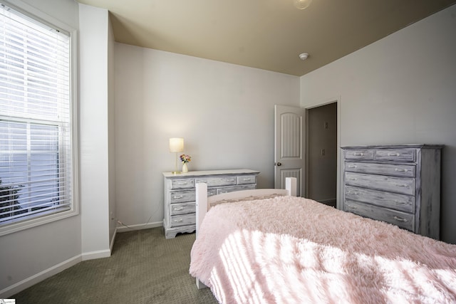 carpeted bedroom with baseboards