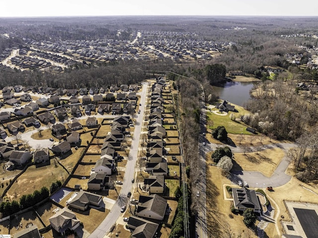 birds eye view of property with a residential view and a water view