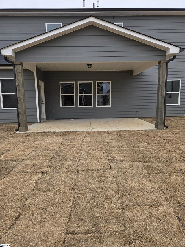 rear view of property with a patio area