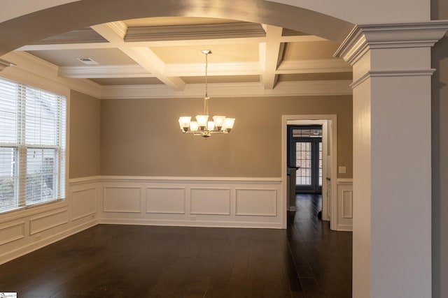 unfurnished dining area with dark wood-style floors, a notable chandelier, beamed ceiling, and visible vents