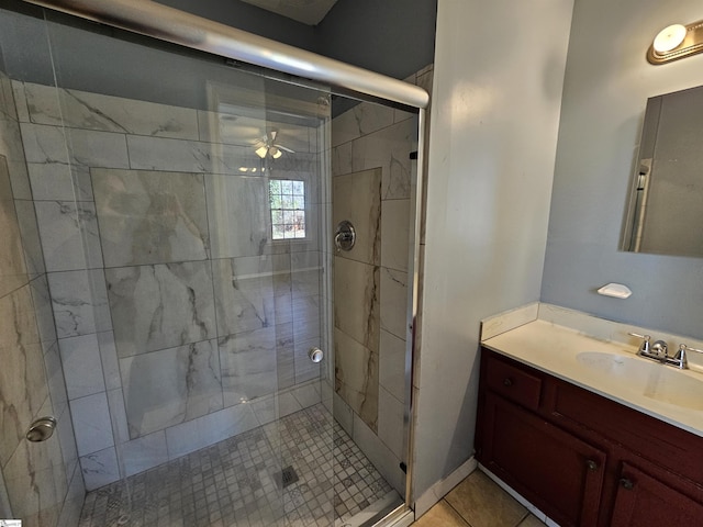 bathroom featuring vanity and a shower stall