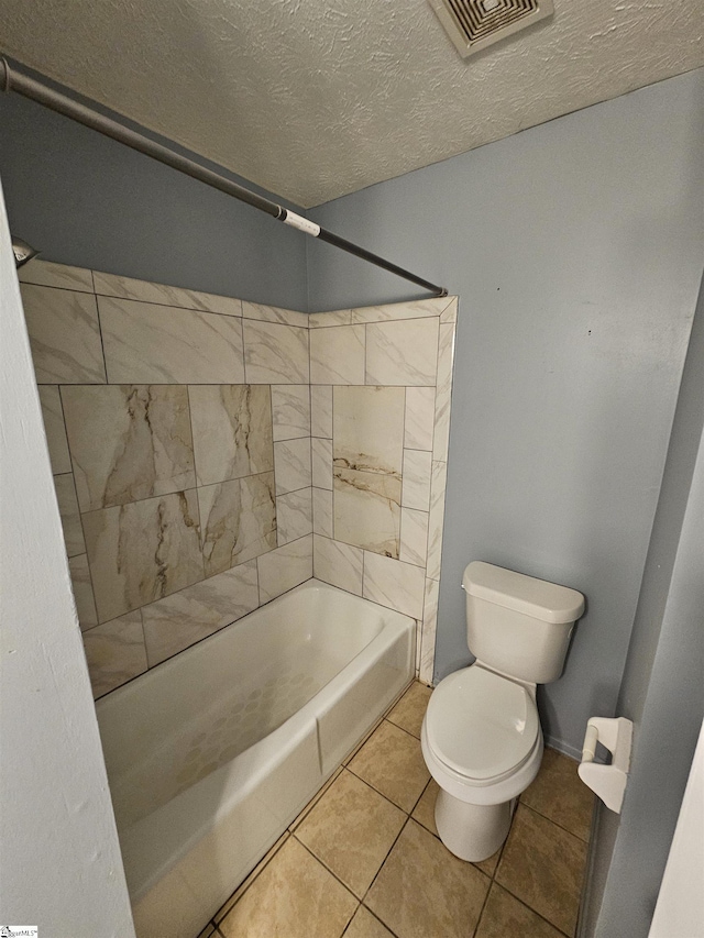 full bathroom featuring a textured ceiling, visible vents, tile patterned flooring, shower / bath combination, and toilet