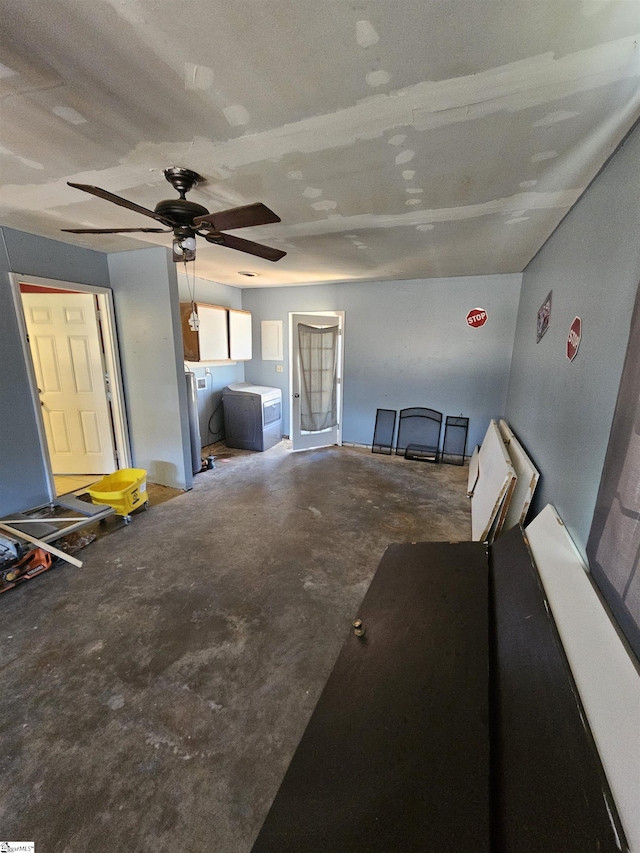 unfurnished living room with unfinished concrete flooring and ceiling fan