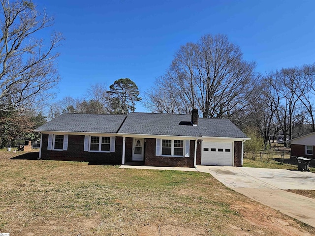 single story home with concrete driveway, a front yard, a garage, brick siding, and a chimney