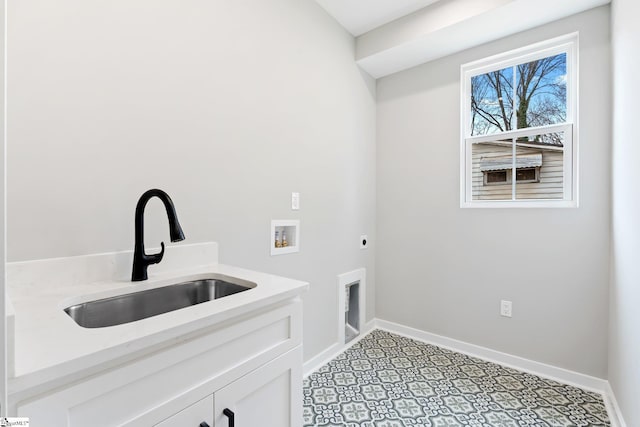 laundry room featuring hookup for a washing machine, baseboards, cabinet space, electric dryer hookup, and a sink