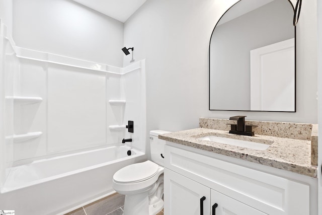 full bath with toilet, vanity, and bathing tub / shower combination