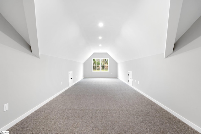 additional living space with recessed lighting, baseboards, carpet, and vaulted ceiling