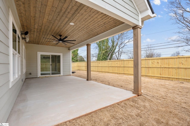 view of patio featuring a ceiling fan and fence