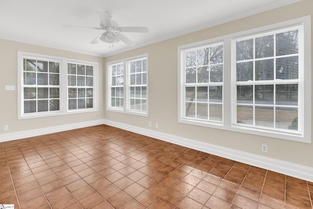 unfurnished sunroom featuring ceiling fan