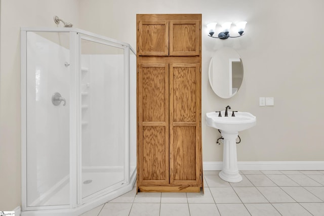 full bathroom featuring baseboards, a stall shower, and tile patterned flooring