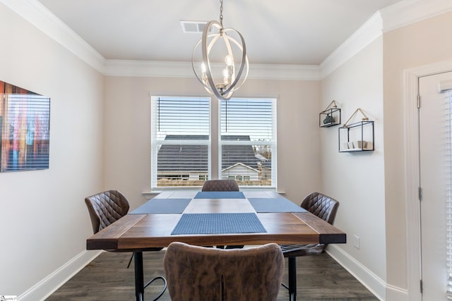 dining room with visible vents, an inviting chandelier, wood finished floors, and crown molding