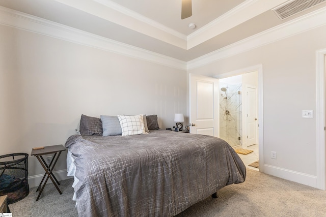 bedroom with baseboards, visible vents, ensuite bath, crown molding, and carpet flooring