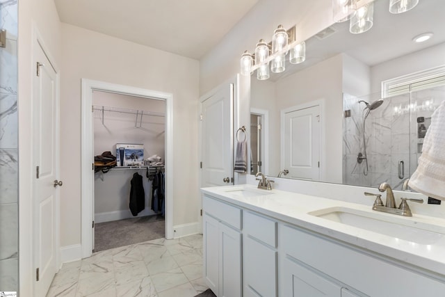 bathroom with a sink, visible vents, marble finish floor, and a shower stall