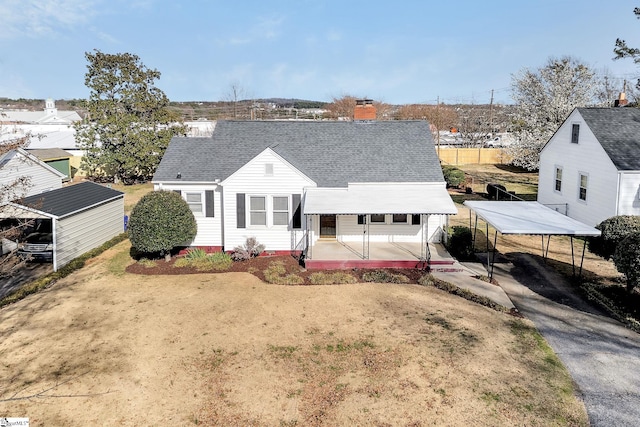 view of front of home featuring a chimney and roof with shingles