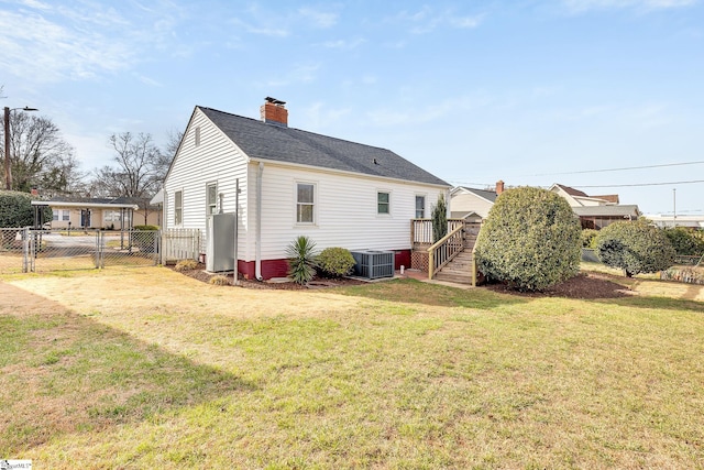 view of property exterior featuring a lawn, a gate, central AC, fence, and a chimney