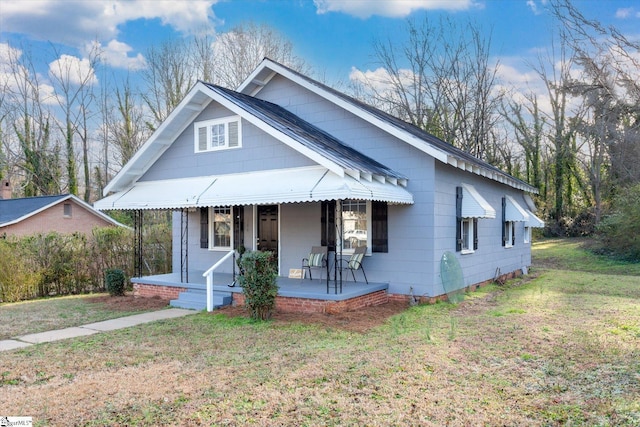 bungalow-style house featuring a front yard and a porch