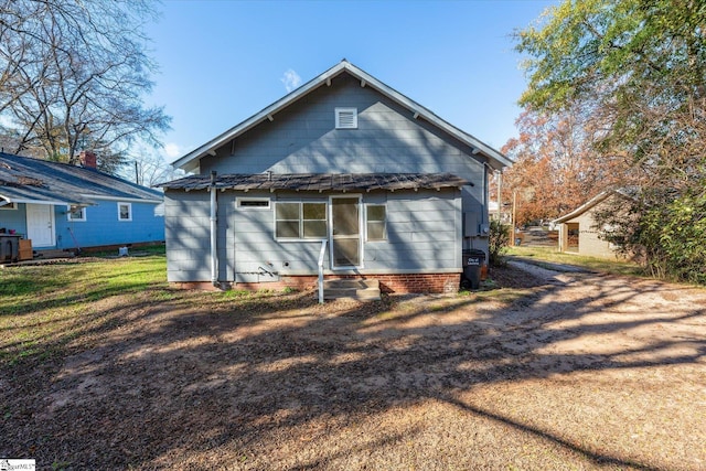 exterior space featuring a front lawn and entry steps