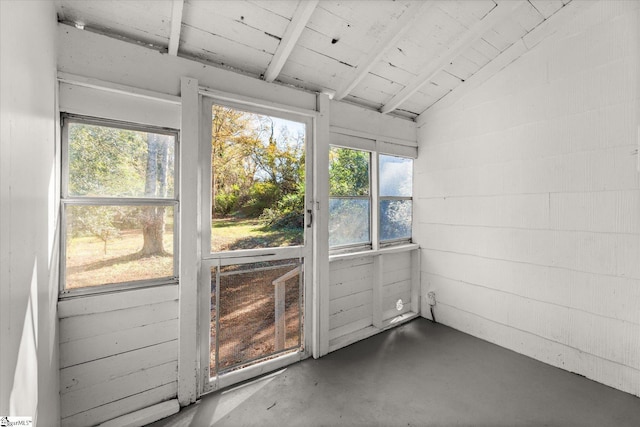 unfurnished sunroom with lofted ceiling