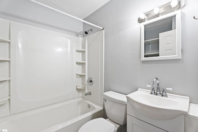 bathroom with bathtub / shower combination, toilet, vanity, and a textured ceiling