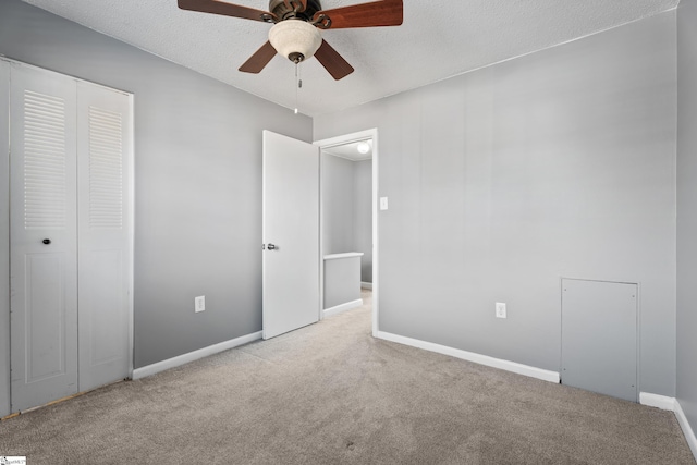 unfurnished bedroom with a closet, baseboards, and carpet floors