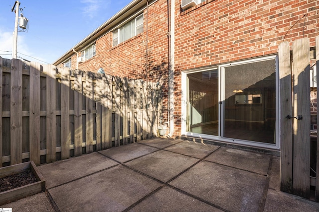 view of patio featuring fence