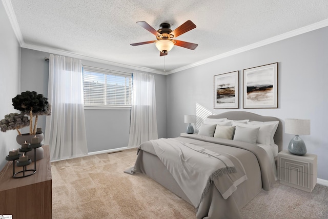 bedroom featuring light colored carpet, a textured ceiling, ceiling fan, and ornamental molding